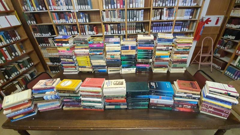 A new partner in South Africa displays books received from EWI