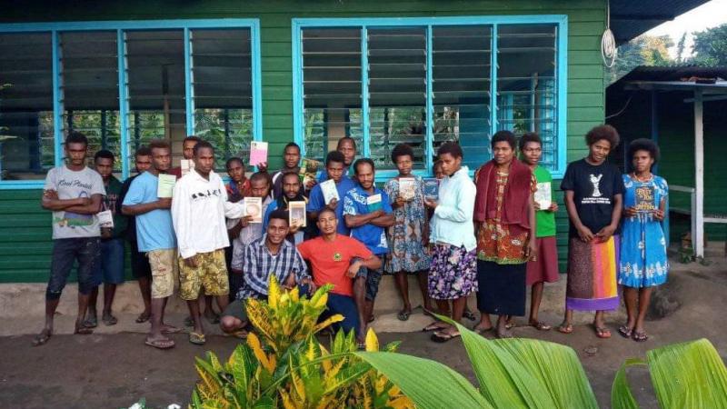 Papua New Guinea Bible school students receive books from EWI to aid in their studies